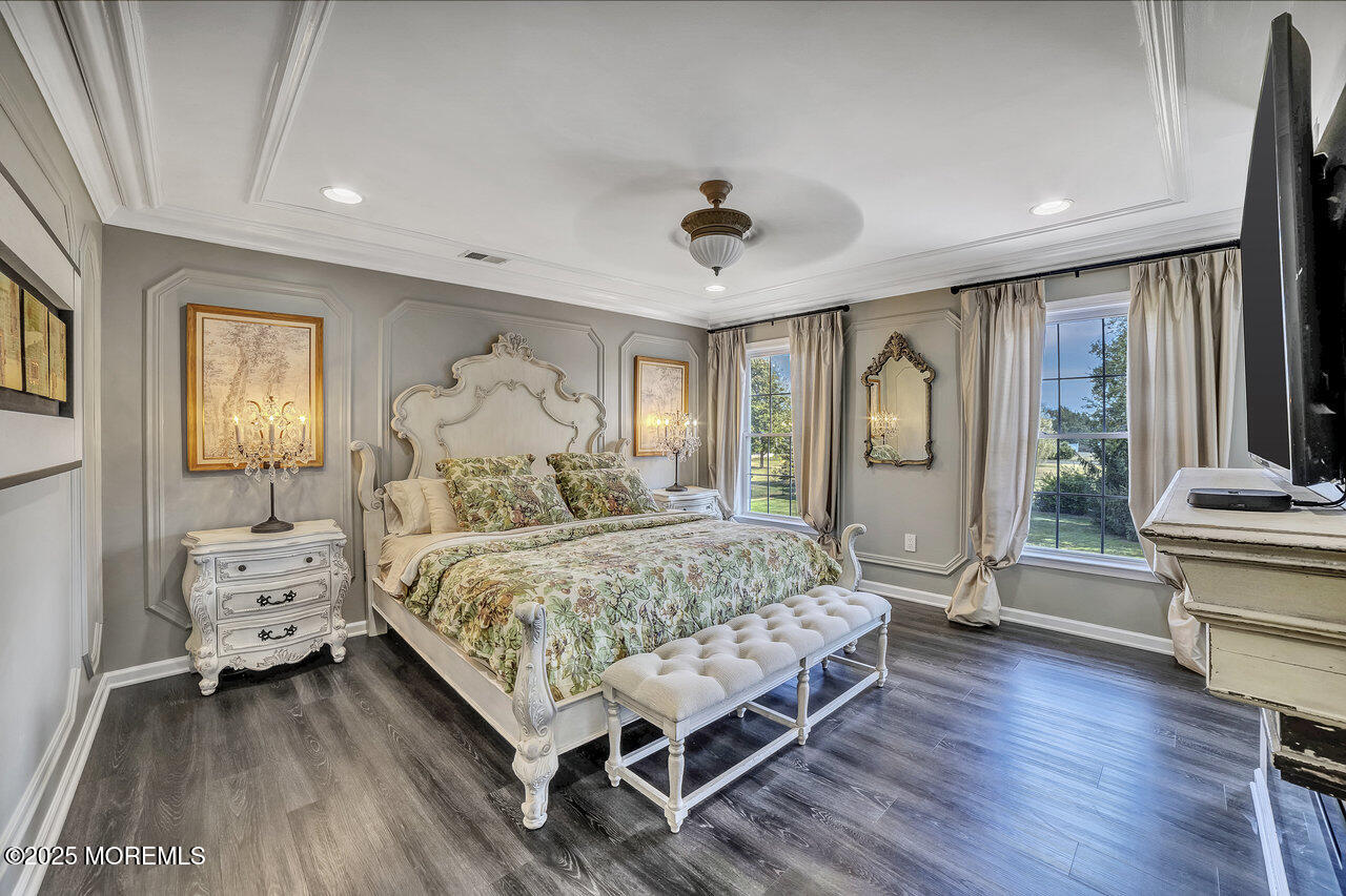 11 Victoria Court Cream Ridge, NJ 08514 - Photo 30 of 67 a bed room with a bed and a mirror