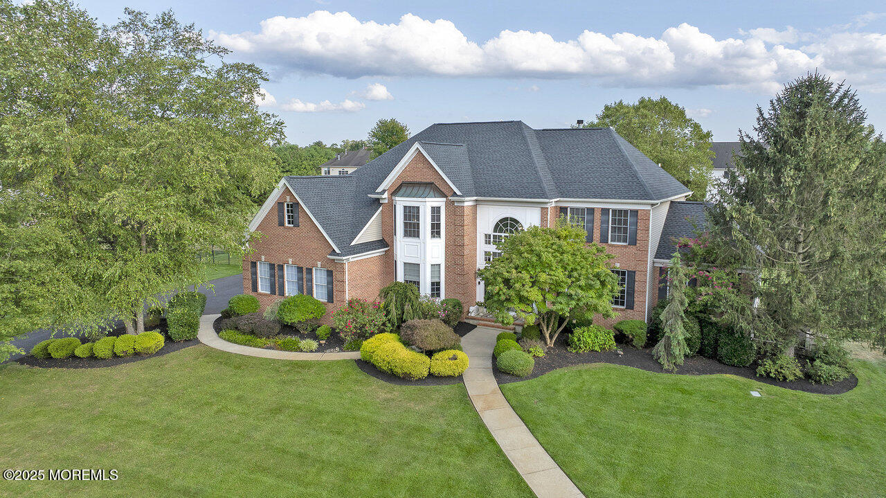 11 Victoria Court Cream Ridge, NJ 08514 - Photo 3 of 67 a front view of a house with a garden and plants