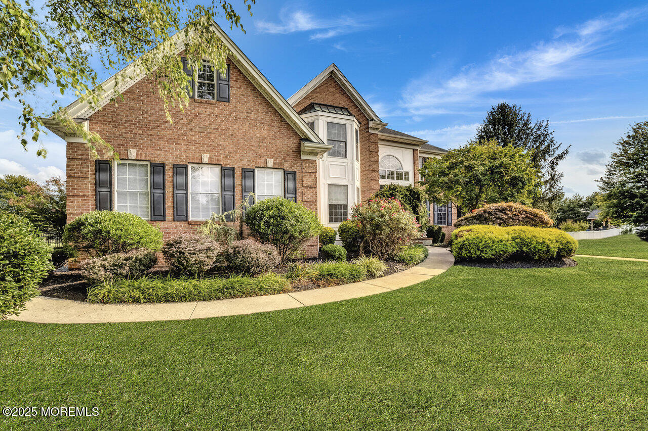 11 Victoria Court Cream Ridge, NJ 08514 - Photo 5 of 67 a front view of a house with a yard