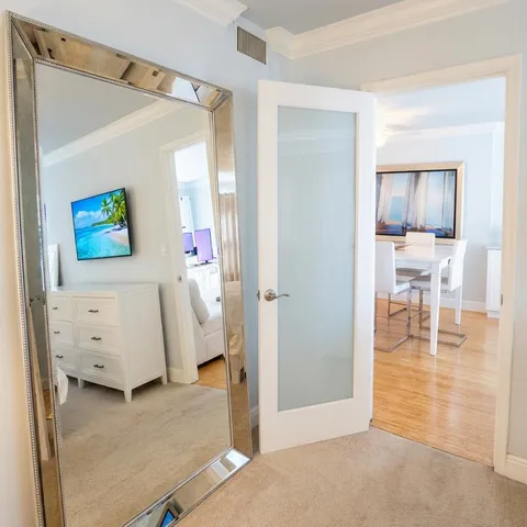 a view of livingroom with furniture and workspace