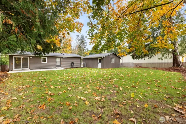 a view of house with yard