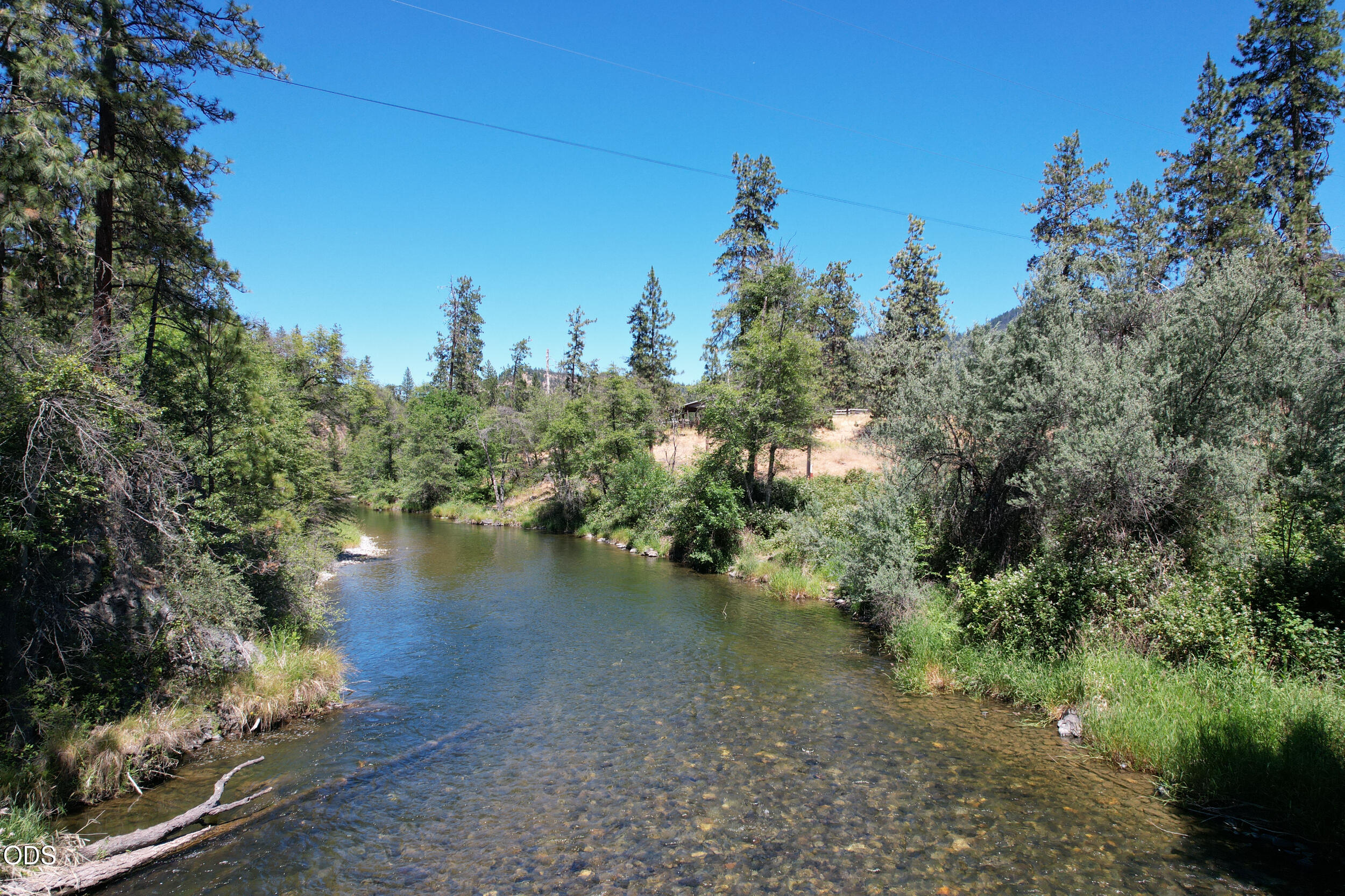 2525 Kinney Creek Road Jacksonville, OR 97530 - Photo 1 of 38 a view of a lake with lots of trees