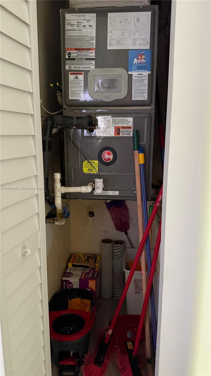 13675 Southwest 62nd Street, Unit 2023 Miami, FL 33183 - Photo 20 of 22 a utility room with dryer and washer