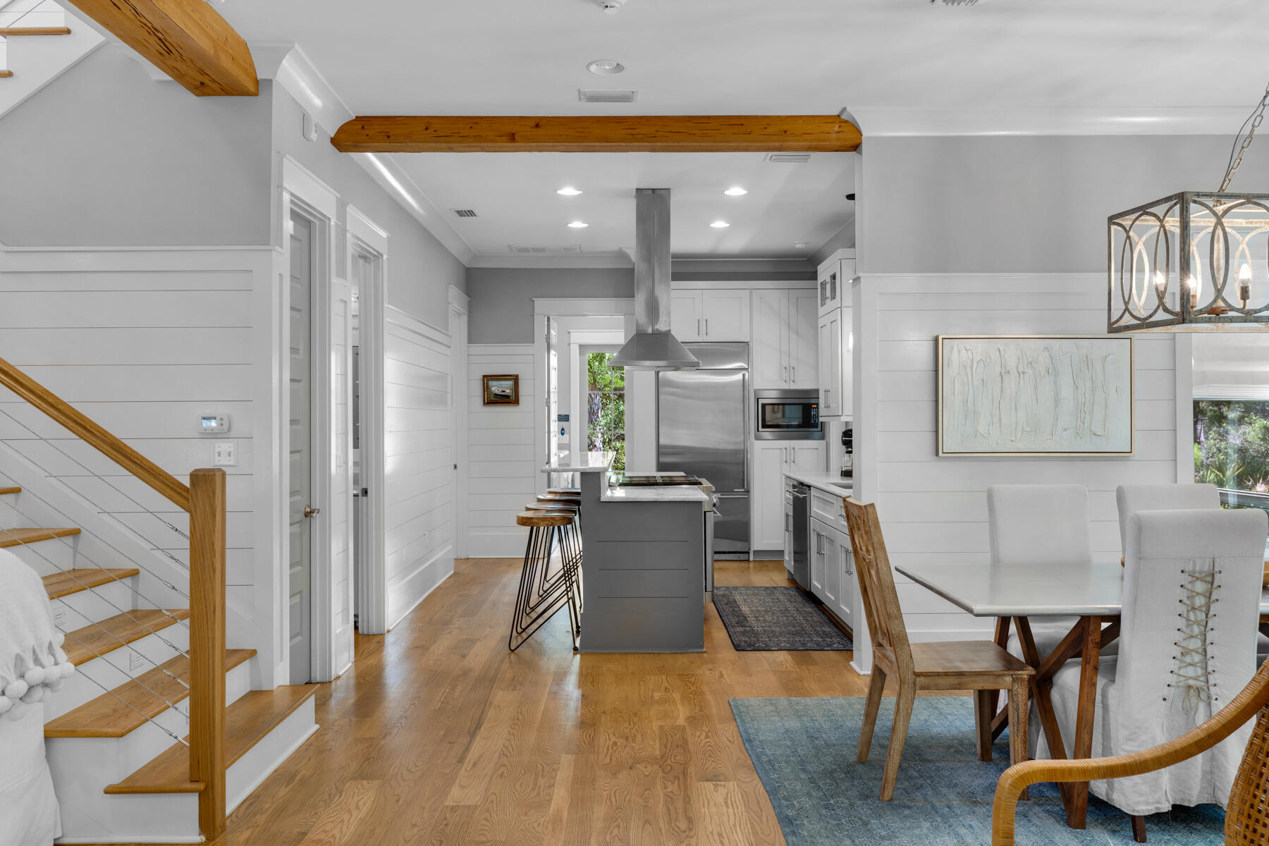 87 Salt Box Lane West Inlet Beach, FL 32461 - Photo 12 of 122 a living room with furniture a rug kitchen view and a table