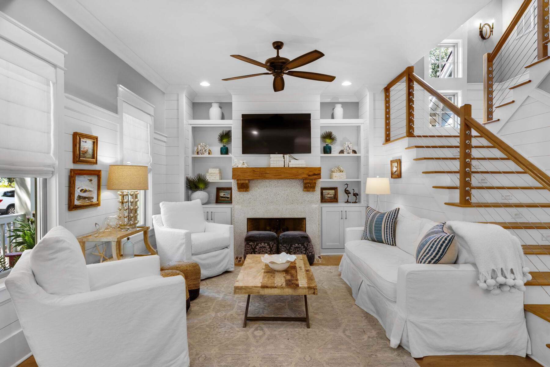 87 Salt Box Lane West Inlet Beach, FL 32461 - Photo 14 of 122 a living room with furniture a flat screen tv and a fireplace