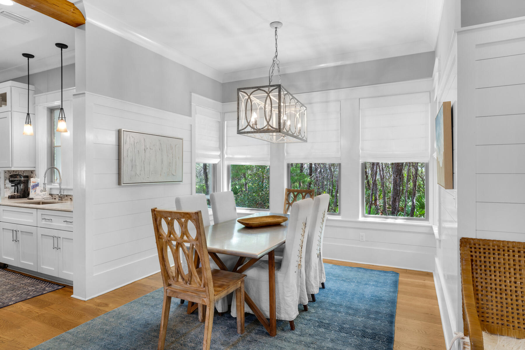 87 Salt Box Lane West Inlet Beach, FL 32461 - Photo 19 of 122 a dining room with furniture a chandelier and wooden floor