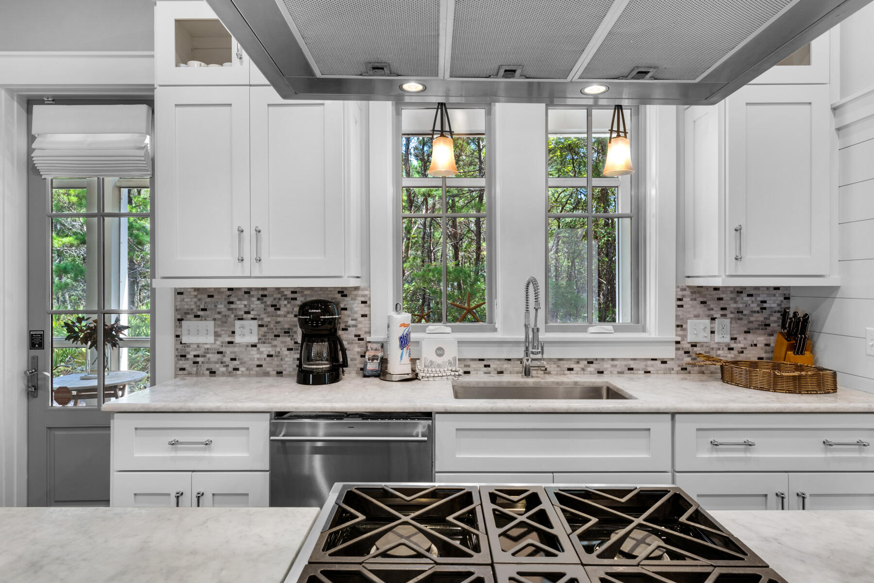 87 Salt Box Lane West Inlet Beach, FL 32461 - Photo 23 of 122 a kitchen with stainless steel appliances kitchen island granite countertop a stove a sink and a granite counter tops