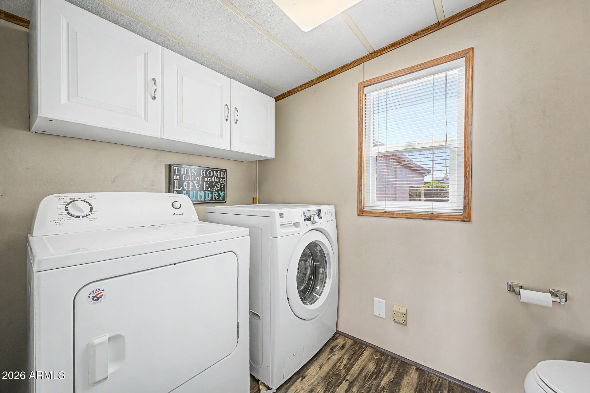 7750 East Broadway Road, Unit 560 Mesa, AZ 85208 - Photo 16 of 18 a utility room with dryer and washer