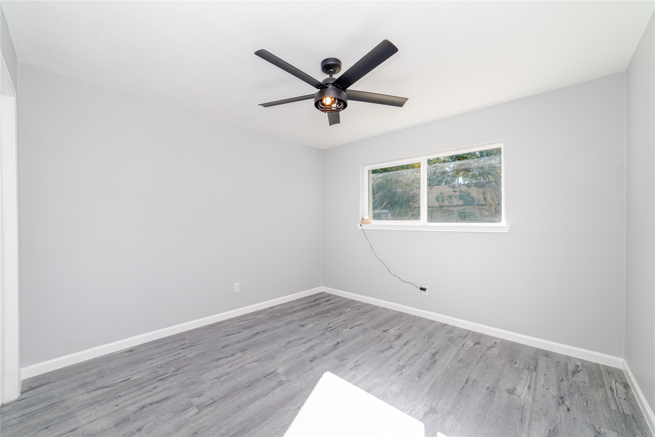 1716 Crestdale Drive, Unit 10 Houston, TX 77080 - Photo 15 of 21 a view of a ceiling fan with wooden floor and a ceiling fan