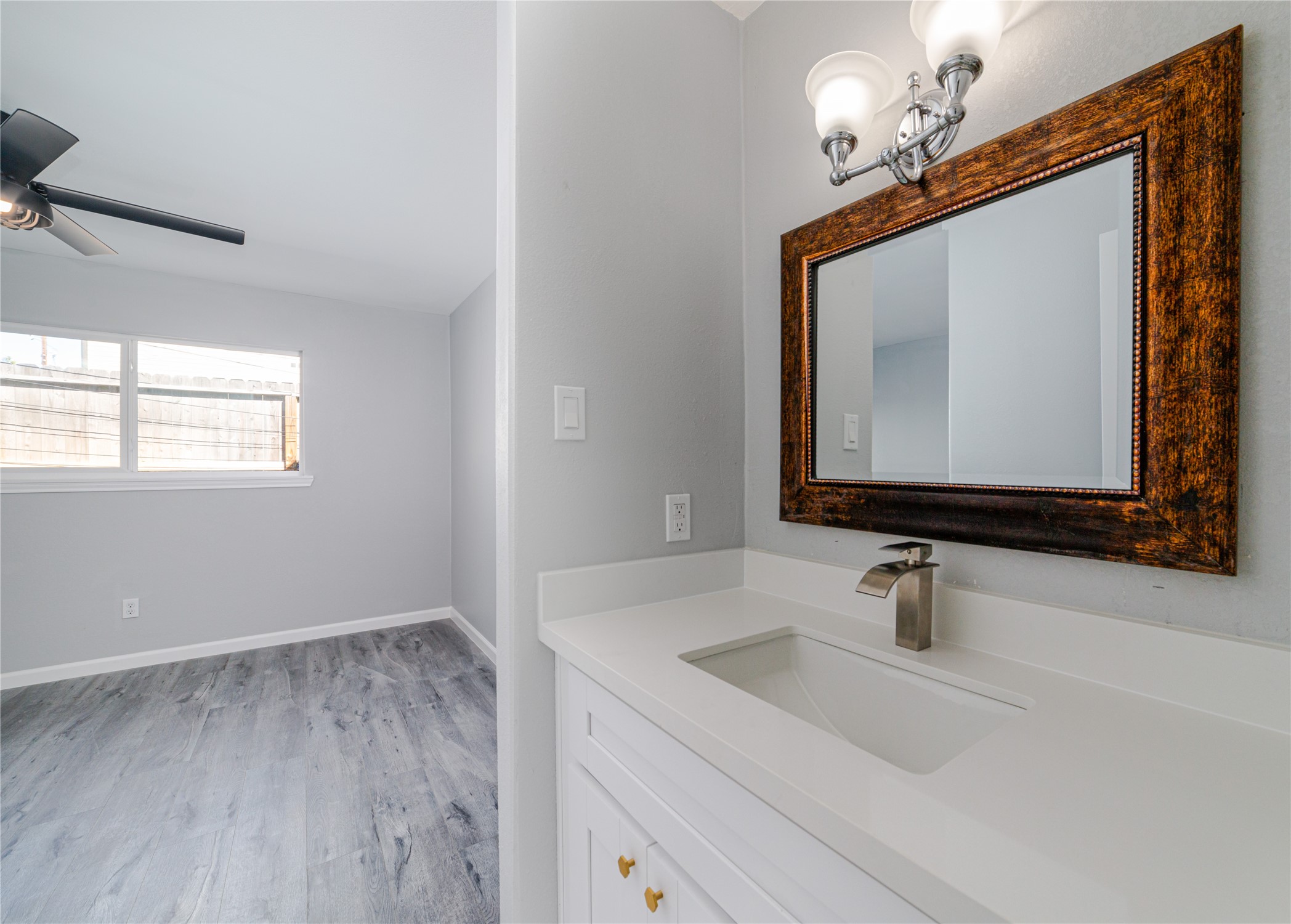 1716 Crestdale Drive, Unit 10 Houston, TX 77080 - Photo 17 of 21 a bathroom with a sink and a mirror