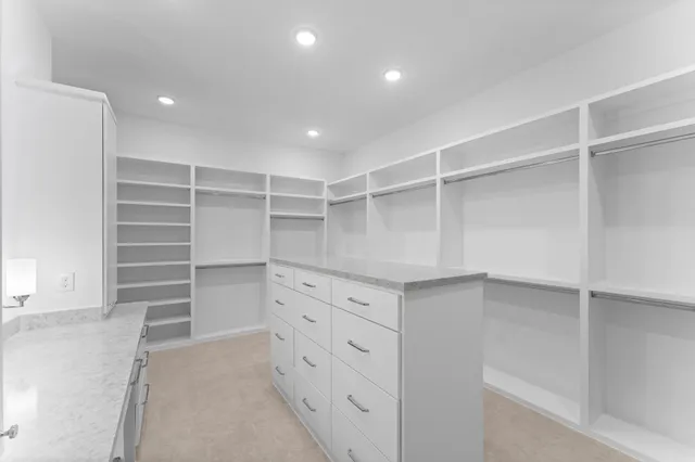 a view of an empty walk in closet