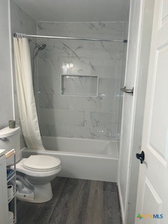 1017 South 6th Street Temple, TX 76504 - Photo 10 of 13 a bathroom with a toilet and a shower