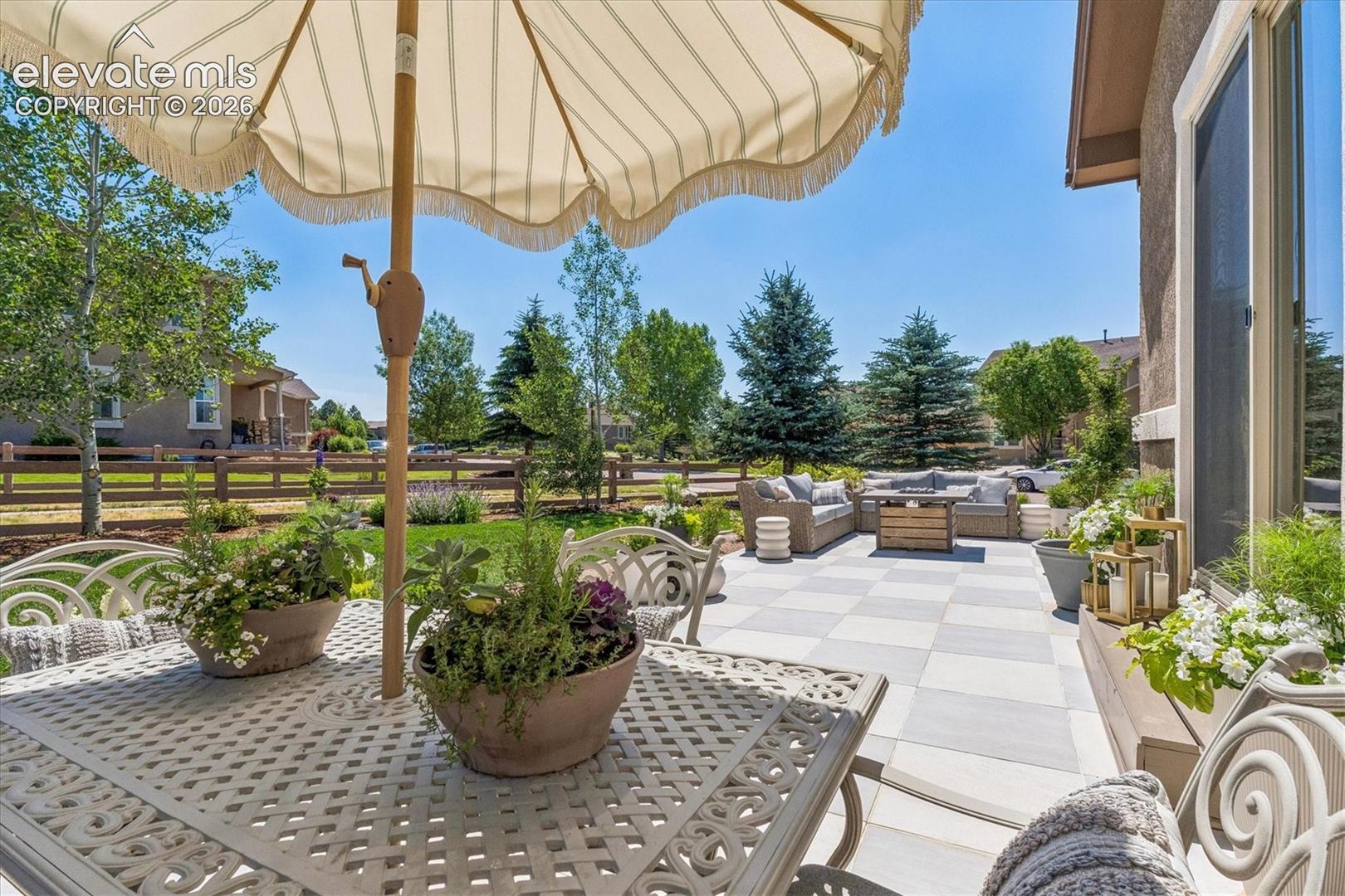 2388 Rusty Ridge Court Colorado Springs, CO 80921 - Photo 39 of 48 Expansive outdoor patio featuring a checkerboard-patterned tile surface