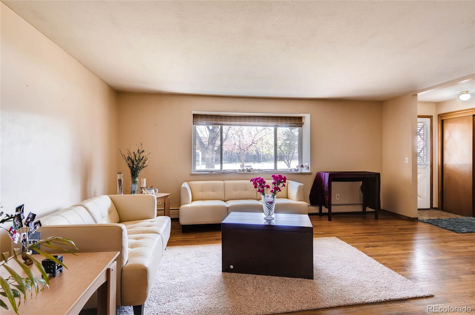 12475 West 38th Avenue Wheat Ridge, CO 80033 - Photo 1 of 22 a living room with furniture and a large window