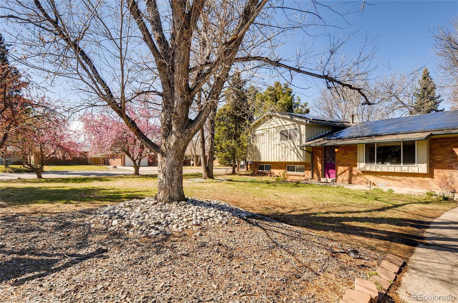 12475 West 38th Avenue Wheat Ridge, CO 80033 - Photo 22 of 22 a view of a house with a yard