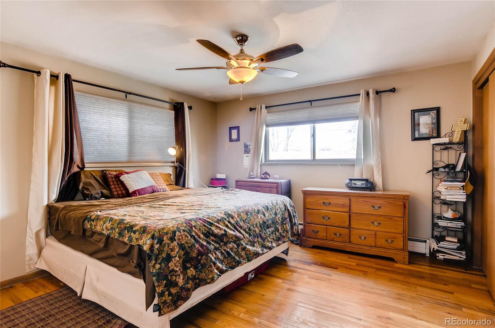 12475 West 38th Avenue Wheat Ridge, CO 80033 - Photo 10 of 22 a bed room with a bed and window