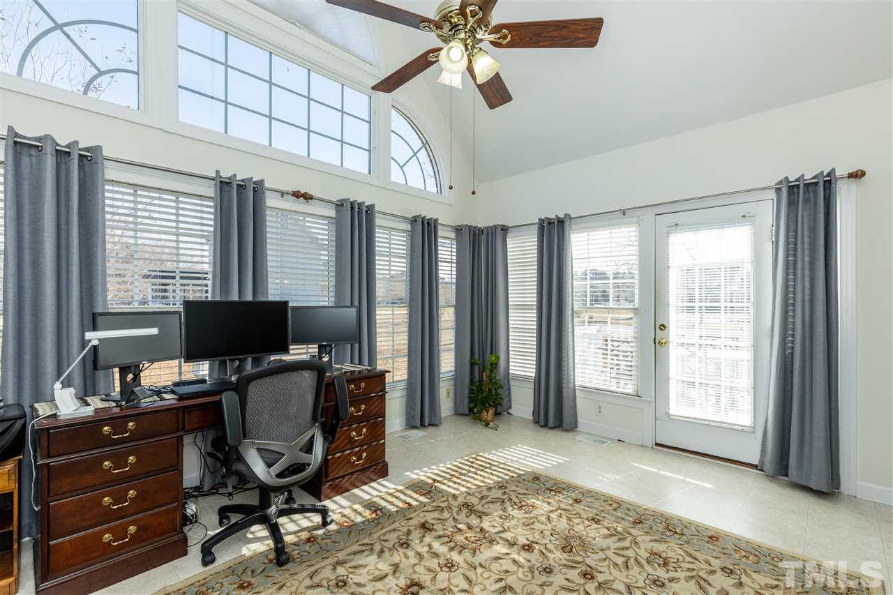 1016 Red Brick Road Garner, NC 27529 - Photo 12 of 29 a view of a workspace with furniture and a window