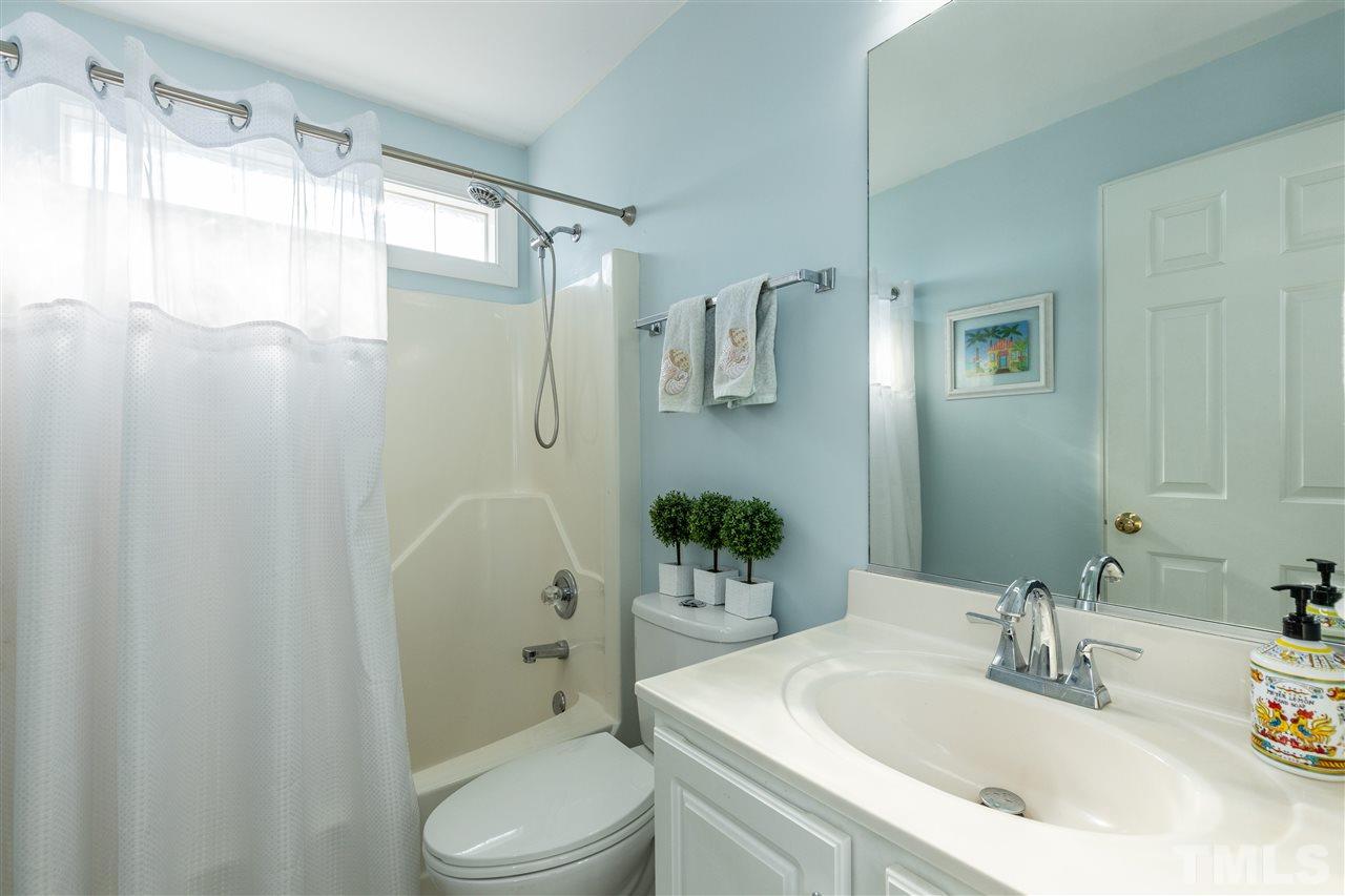 1016 Red Brick Road Garner, NC 27529 - Photo 18 of 29 a bathroom with a sink toilet and shower