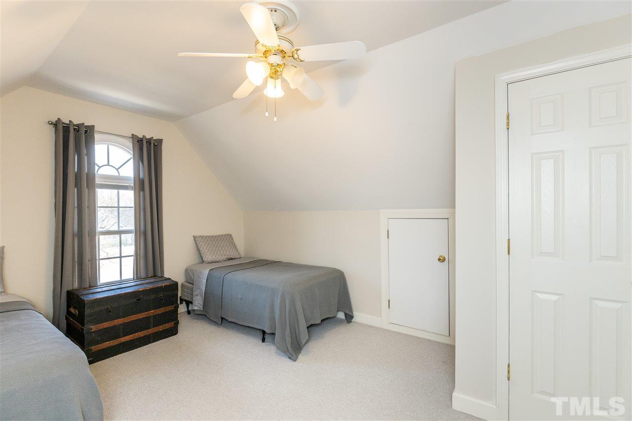 1016 Red Brick Road Garner, NC 27529 - Photo 20 of 29 a bedroom with a bed and a window