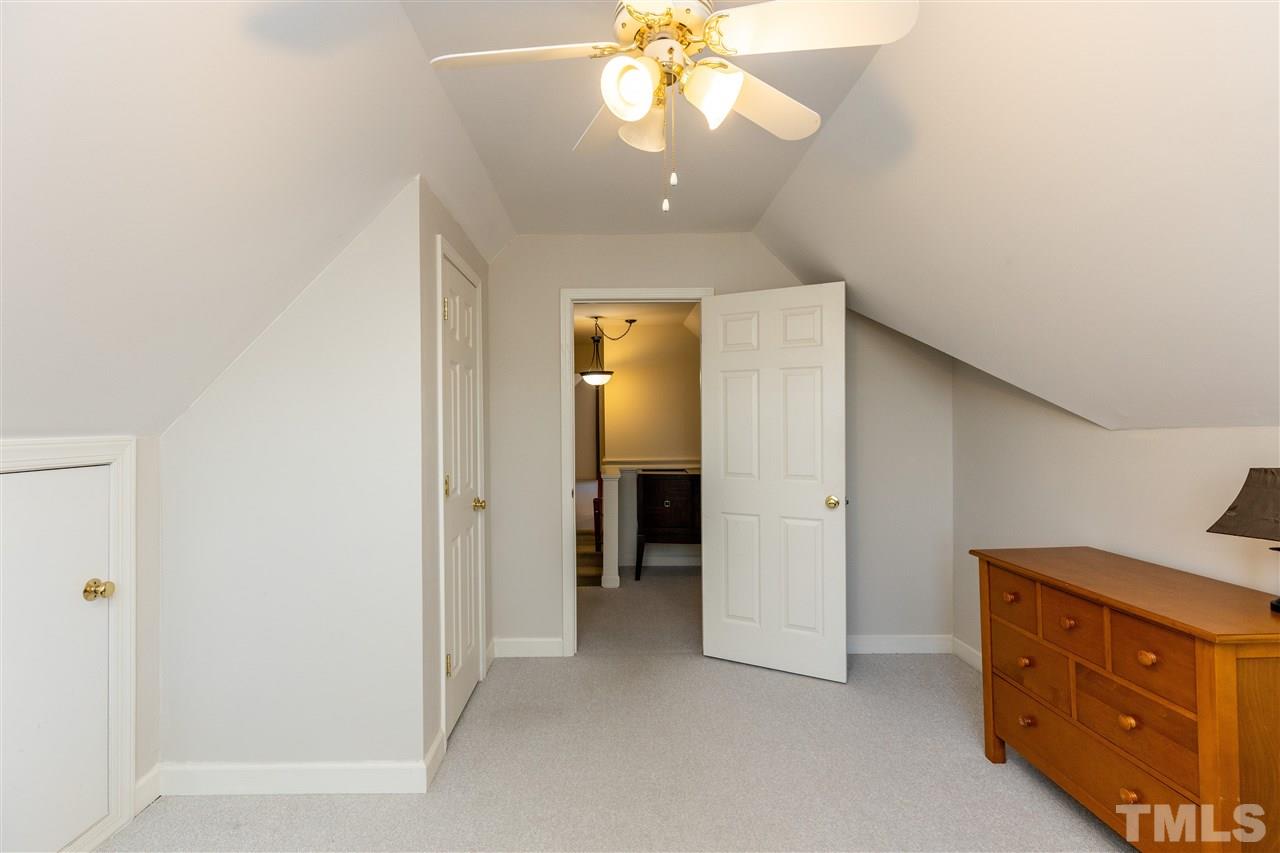 1016 Red Brick Road Garner, NC 27529 - Photo 21 of 29 wooden floor in an empty room with a window