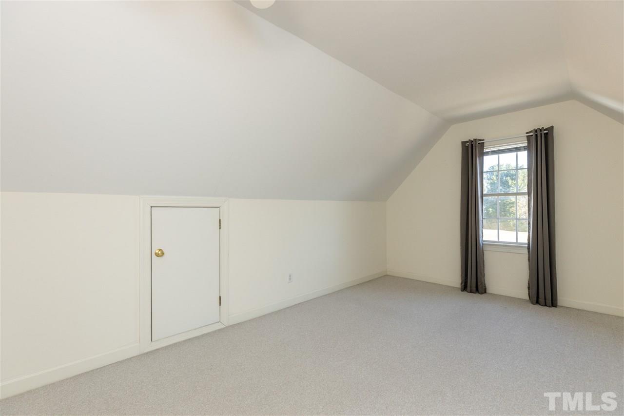 1016 Red Brick Road Garner, NC 27529 - Photo 22 of 29 an empty room with windows