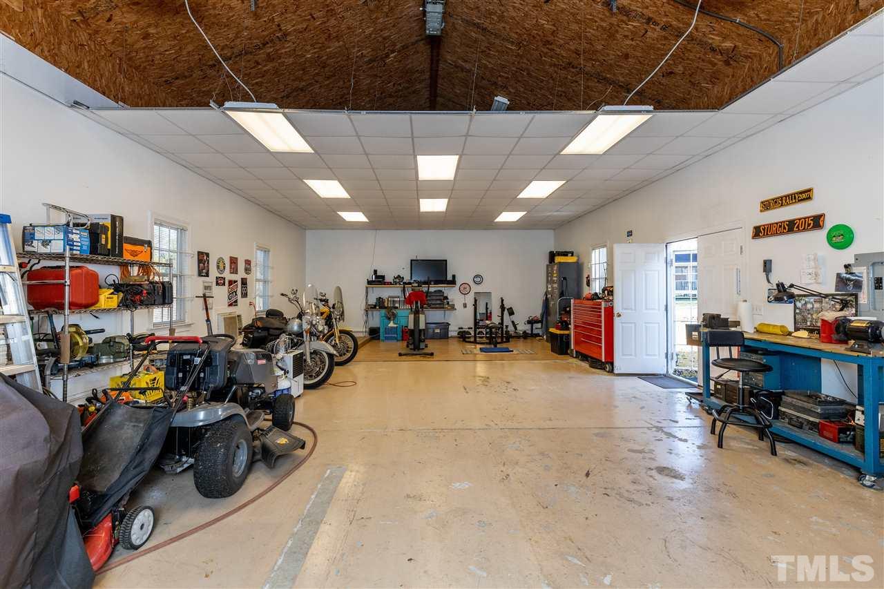 1016 Red Brick Road Garner, NC 27529 - Photo 28 of 29 a view of a room with gym equipment