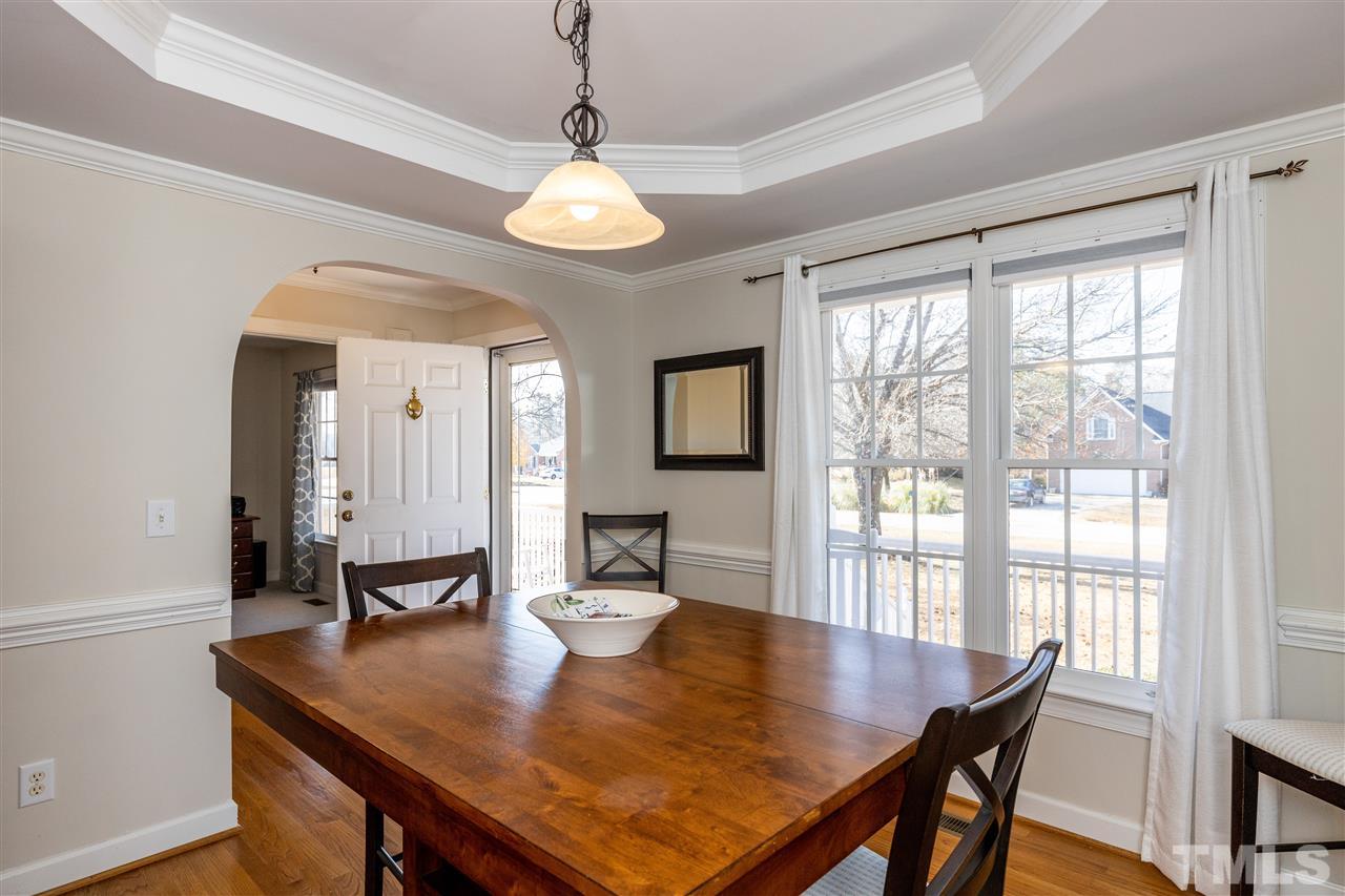 1016 Red Brick Road Garner, NC 27529 - Photo 5 of 29 a view of a dining room with furniture window and wooden floor