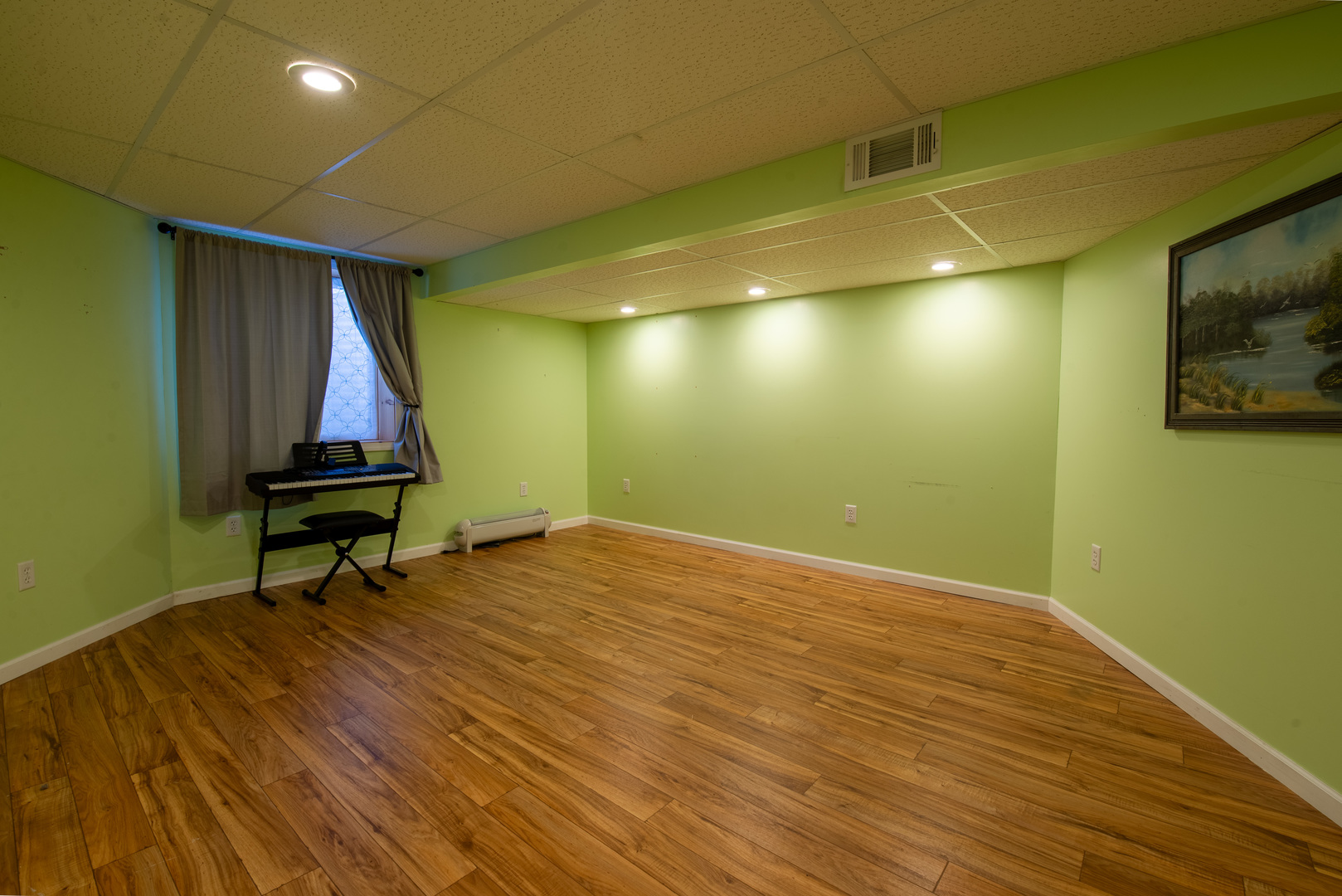 9109 Messmer Road Savanna, IL 61074 - Photo 14 of 31 a room with wooden floor and furniture