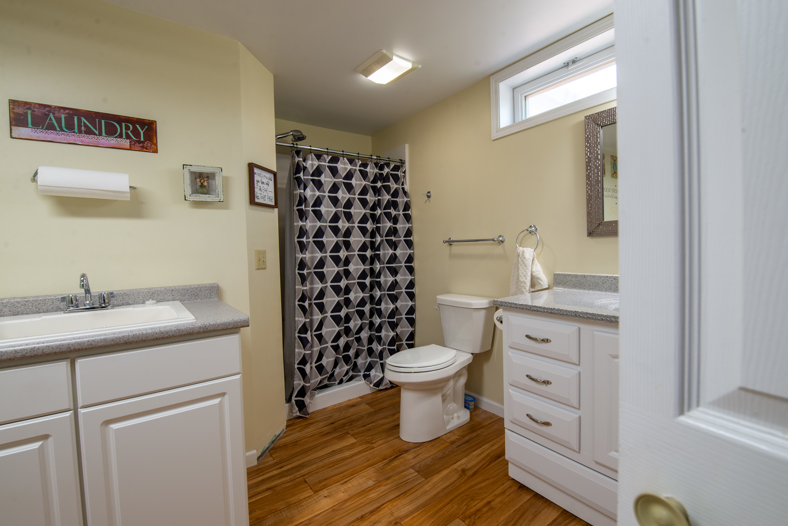 9109 Messmer Road Savanna, IL 61074 - Photo 16 of 31 a bathroom with a sink toilet a mirror and shower