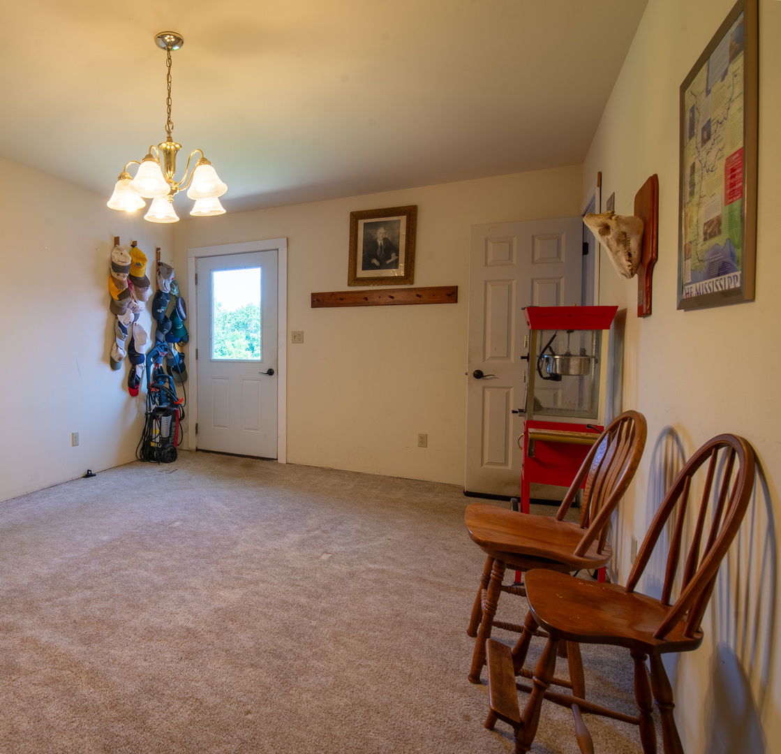9109 Messmer Road Savanna, IL 61074 - Photo 18 of 31 a view of a livingroom with furniture and a chandelier