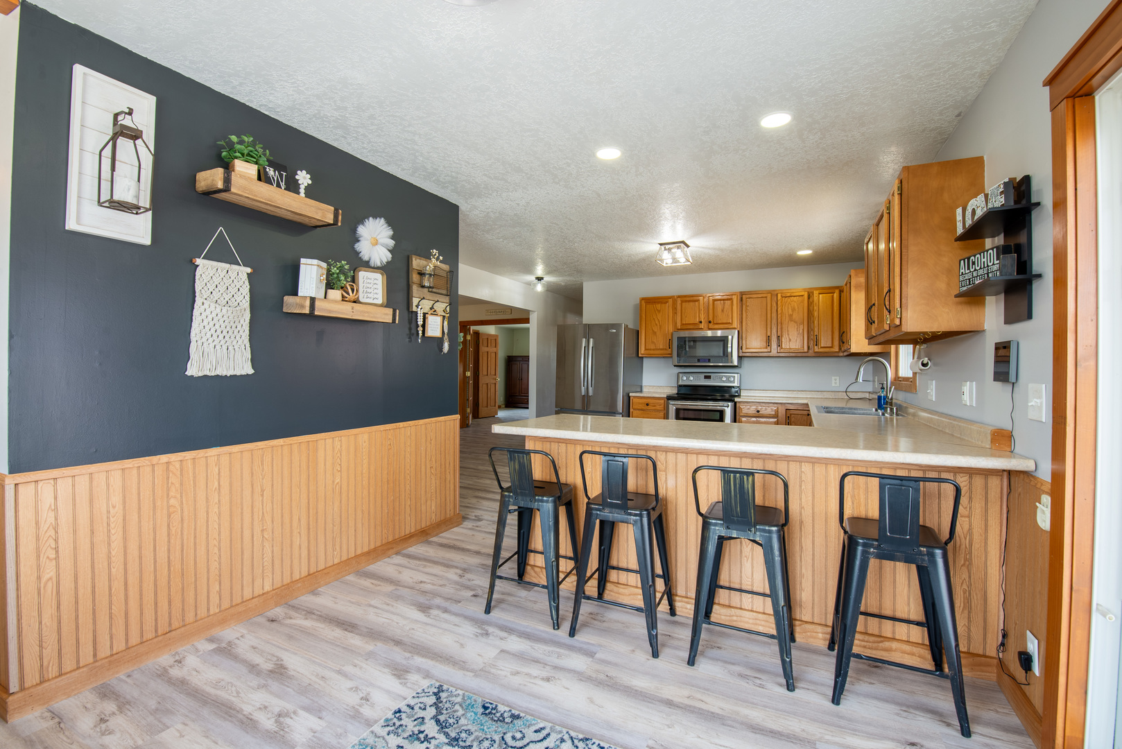 9109 Messmer Road Savanna, IL 61074 - Photo 20 of 31 a kitchen with stainless steel appliances granite countertop a refrigerator and microwave