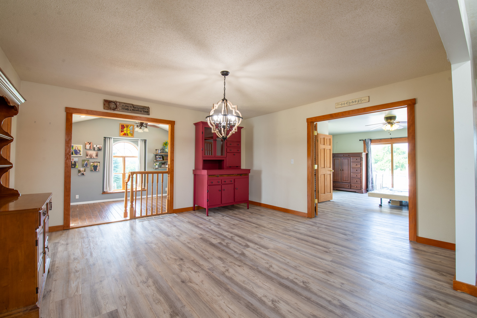 9109 Messmer Road Savanna, IL 61074 - Photo 4 of 31 a big room with wooden floor chandelier and windows