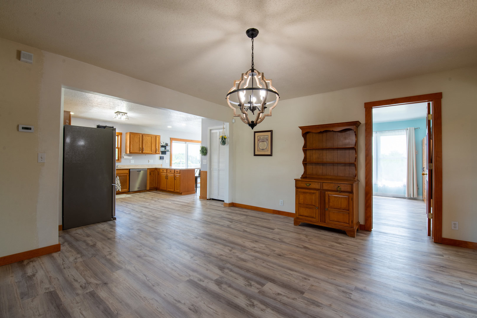 9109 Messmer Road Savanna, IL 61074 - Photo 7 of 31 a view of a room with wooden floor staircase and a kitchen
