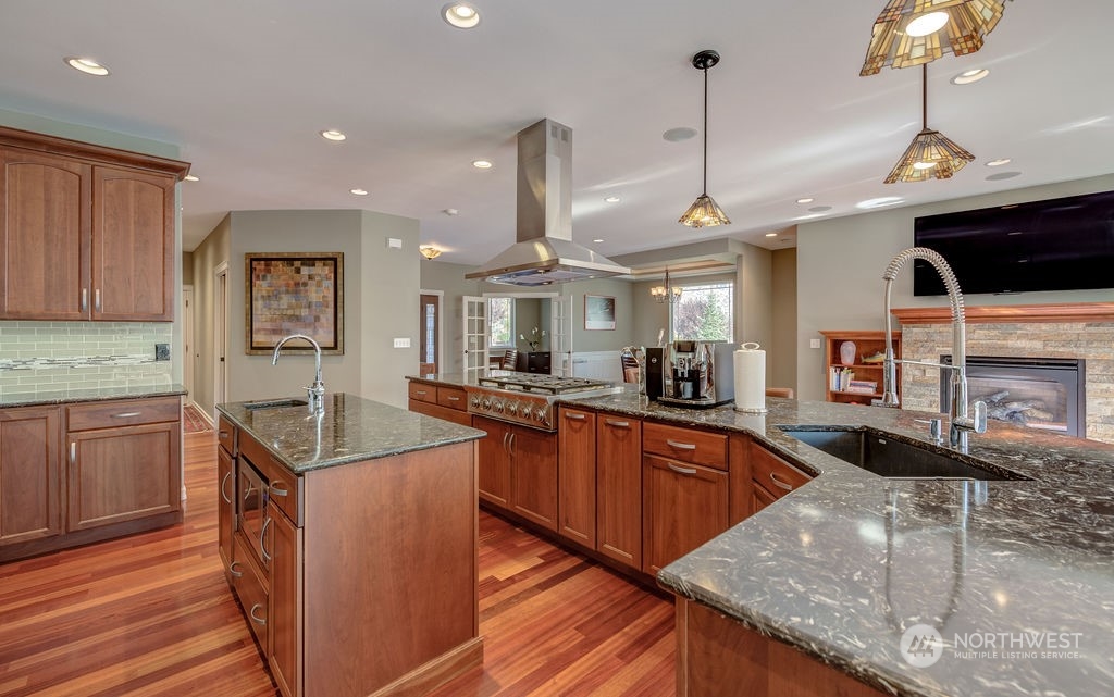 1665 Pitcher Canyon Road Wenatchee, WA 98801 - Photo 12 of 39 a kitchen with stainless steel appliances granite countertop a sink a stove and a wooden floors