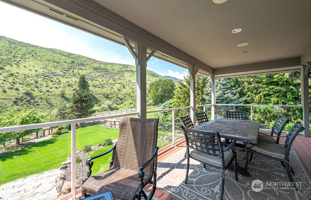 1665 Pitcher Canyon Road Wenatchee, WA 98801 - Photo 14 of 39 a view of a porch with furniture and backyard