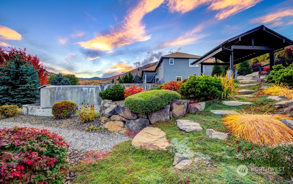 1665 Pitcher Canyon Road Wenatchee, WA 98801 - Photo 17 of 39 a front view of a house with garden