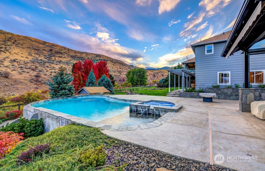 1665 Pitcher Canyon Road Wenatchee, WA 98801 - Photo 2 of 39 a view of a patio with a table and chairs