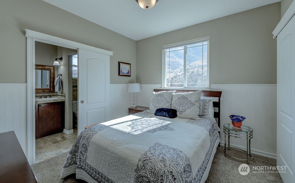 1665 Pitcher Canyon Road Wenatchee, WA 98801 - Photo 23 of 39 a bedroom with a bed and a window