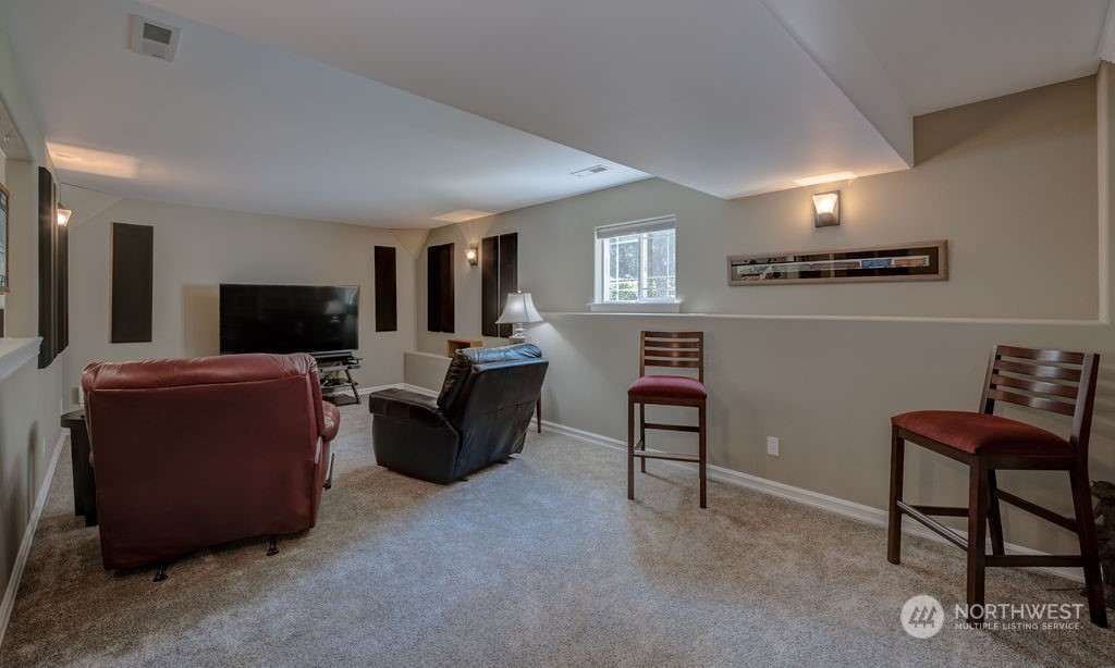 1665 Pitcher Canyon Road Wenatchee, WA 98801 - Photo 26 of 39 a living room with furniture and a flat screen tv