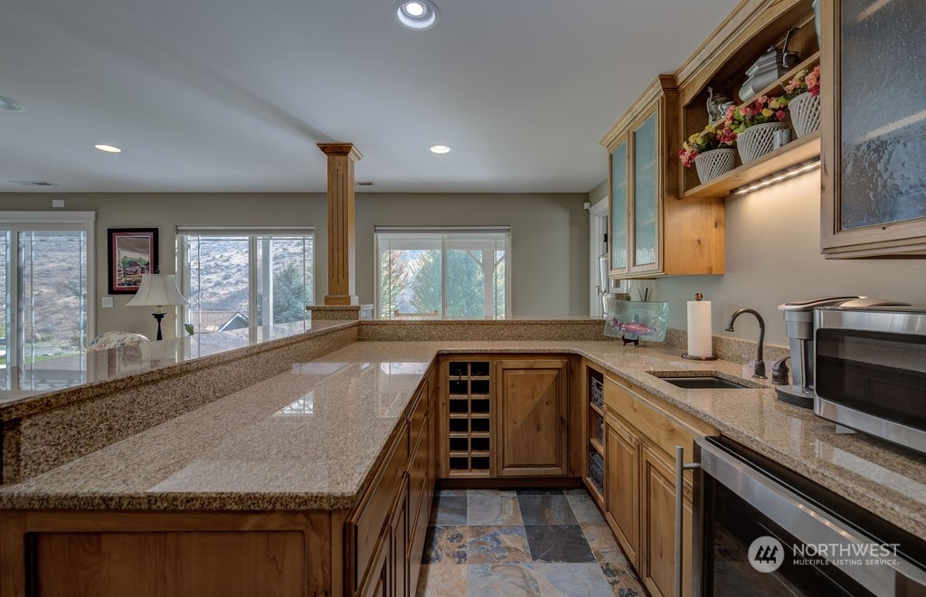 1665 Pitcher Canyon Road Wenatchee, WA 98801 - Photo 27 of 39 a kitchen with sink a stove and cabinets