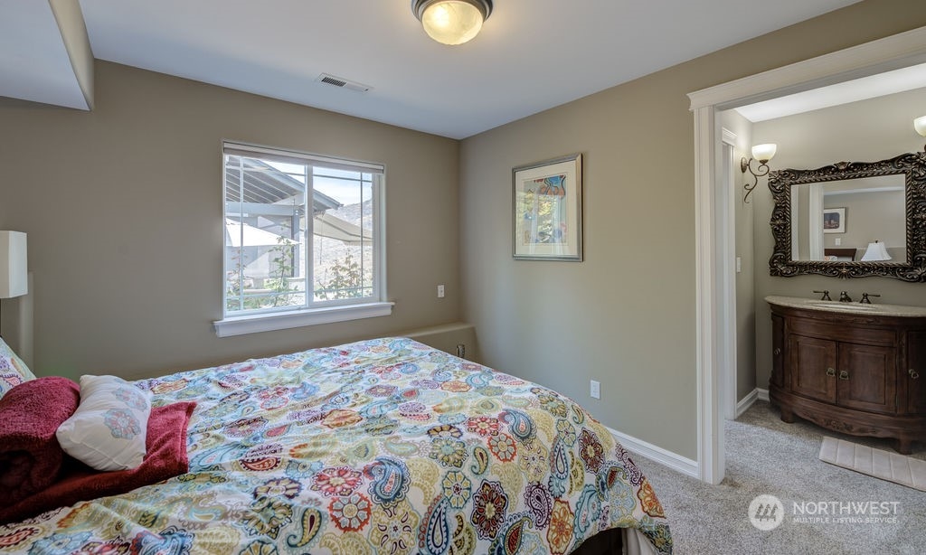 1665 Pitcher Canyon Road Wenatchee, WA 98801 - Photo 29 of 39 a bedroom with a bed and a window