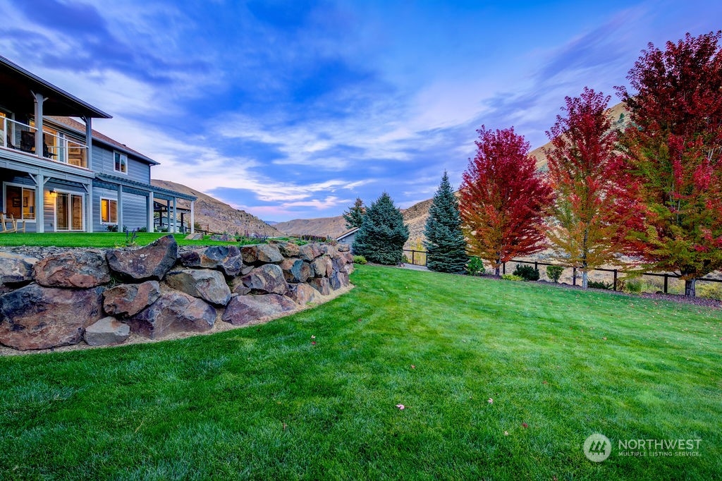 1665 Pitcher Canyon Road Wenatchee, WA 98801 - Photo 34 of 39 a view of a house with a yard