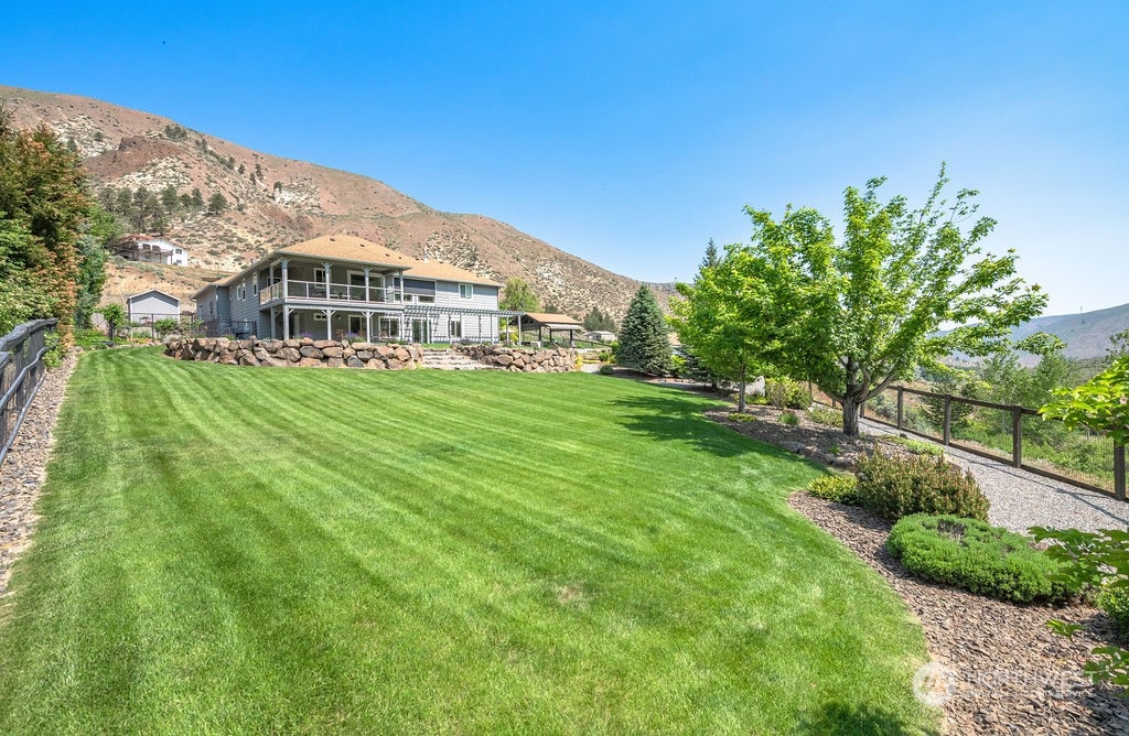 1665 Pitcher Canyon Road Wenatchee, WA 98801 - Photo 36 of 39 a front view of a house with a yard