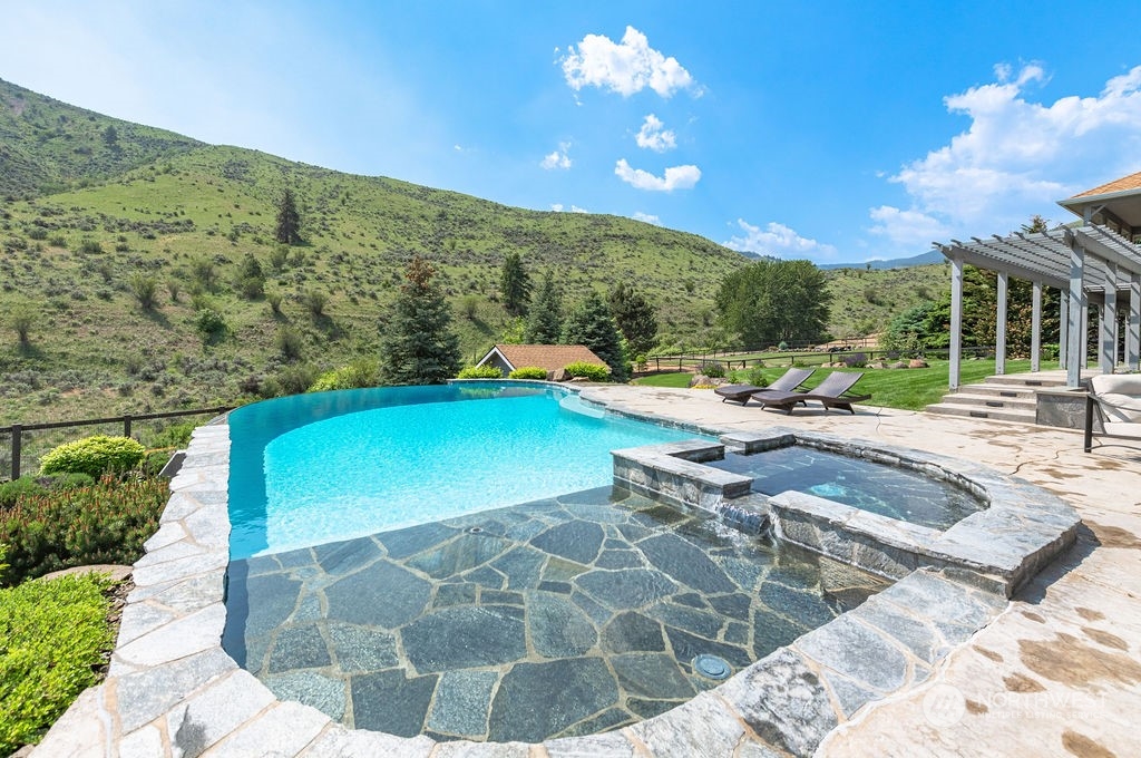 1665 Pitcher Canyon Road Wenatchee, WA 98801 - Photo 5 of 39 a view of a swimming pool with a patio