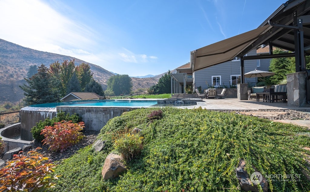 1665 Pitcher Canyon Road Wenatchee, WA 98801 - Photo 6 of 39 a swimming pool with outdoor seating and yard