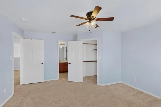 a view of a livingroom with a ceiling fan