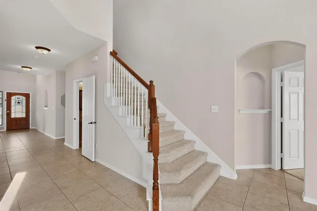 a view of a hallway with staircase