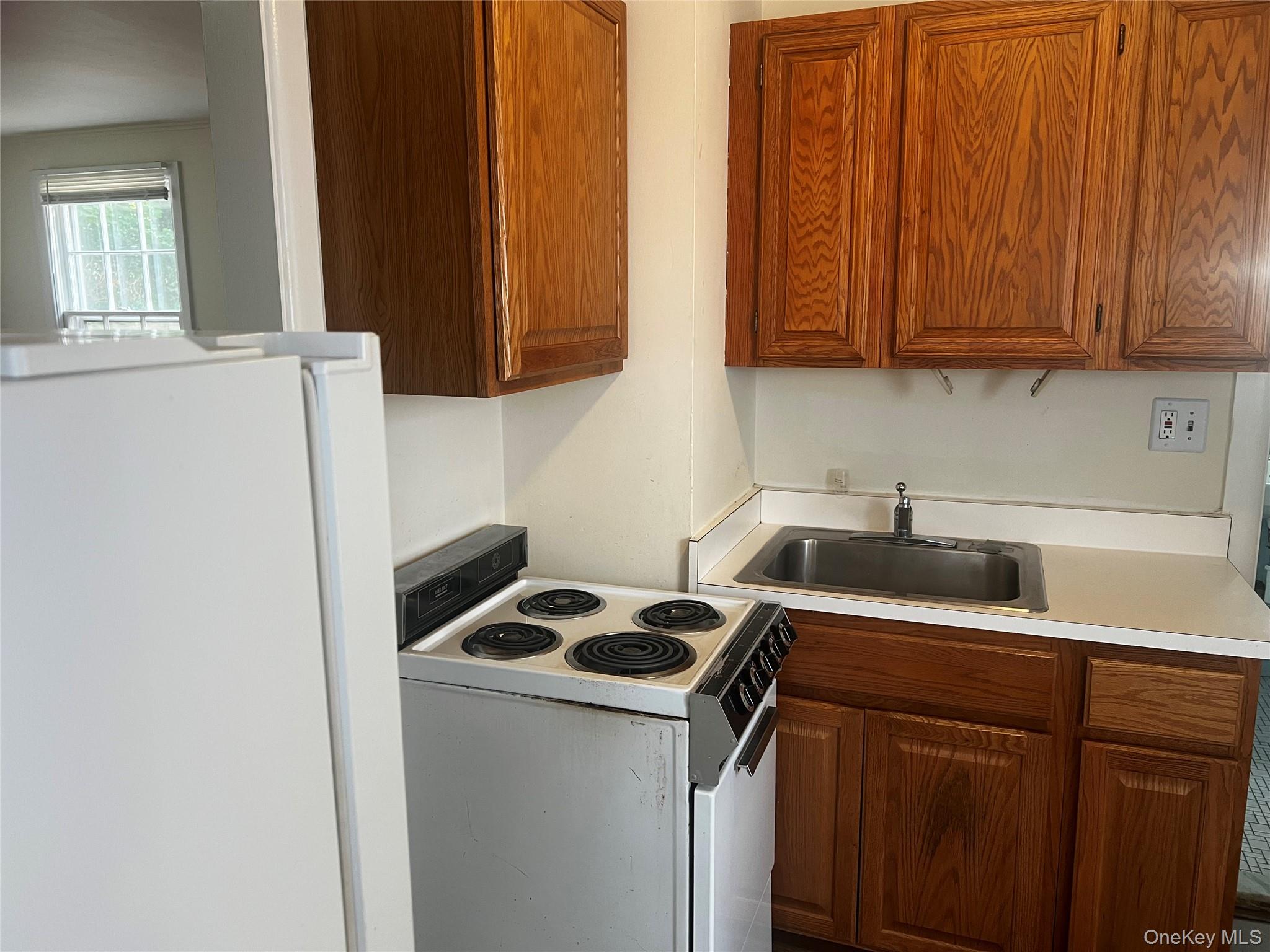 14 Oyster Bay Road Locust Valley, NY 11560 - Photo 3 of 3 a utility room with sink dryer and washer