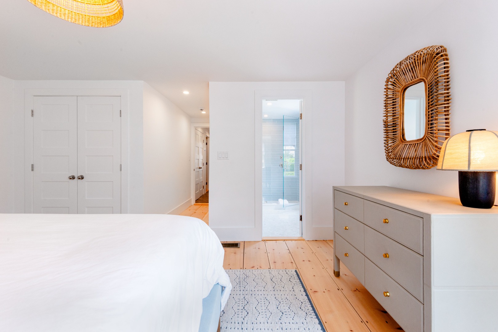 12 Willard Street Nantucket, MA 02554 - Photo 20 of 36 a spacious bedroom with a bed and a mirror