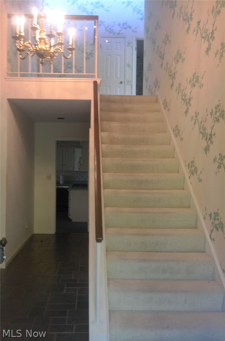 3775 Lander Road, Unit 1 Orange, OH 44022 - Photo 4 of 15 Foyer has an open loft area at the top of stairs. Opens to den on right and vaulted living room to the left.